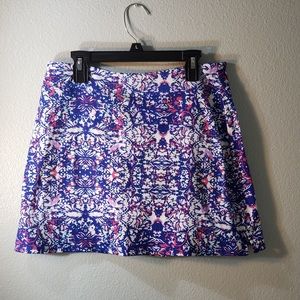 Blue, pink, purple, and white patterned skirt.